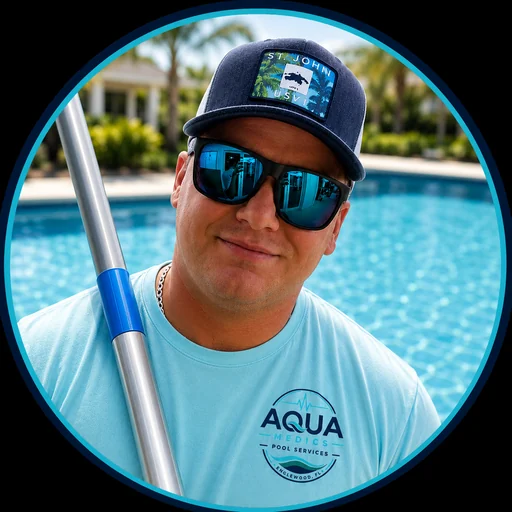 Garrett MacLean, owner of Aqua Medics Pool Services, holding a pool pole beside a turquoise pool in Englewood, Florida